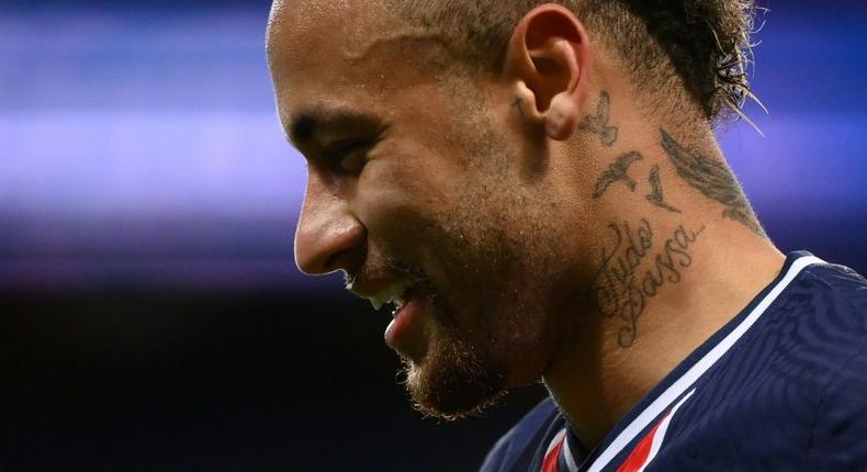 All smiles: Paris Saint-Germain's Neymar reacts after scoring on Sunday