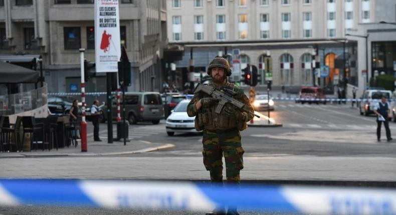 A soldier stands alert in a cordoned off area outside Gare Central in Brussels on June 20, 2017, after an explosion