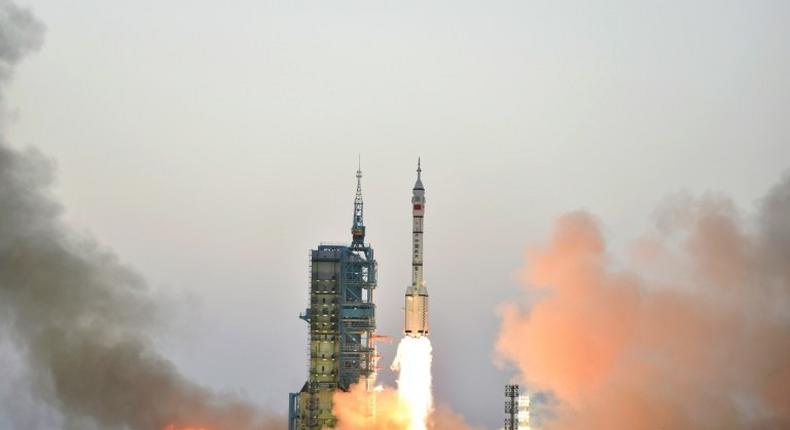 China's Long March-2F carrier rocket transporting the manned spacecraft Shenzhou-11 blasts off from the launch pad at the Jiuquan Satellite Launch Center in north-western Gansu Province, on October 17, 2016