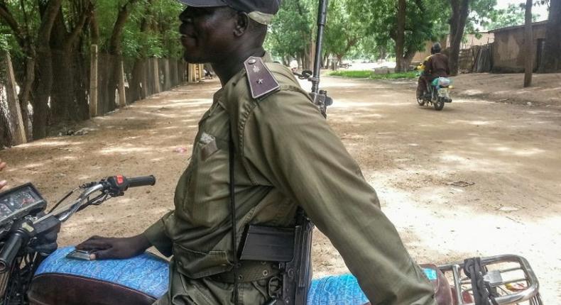 A Cameroonian policeman patrols in Kourgui, in the extreme northern province, west of the Nigerian border, on September 16, 2016