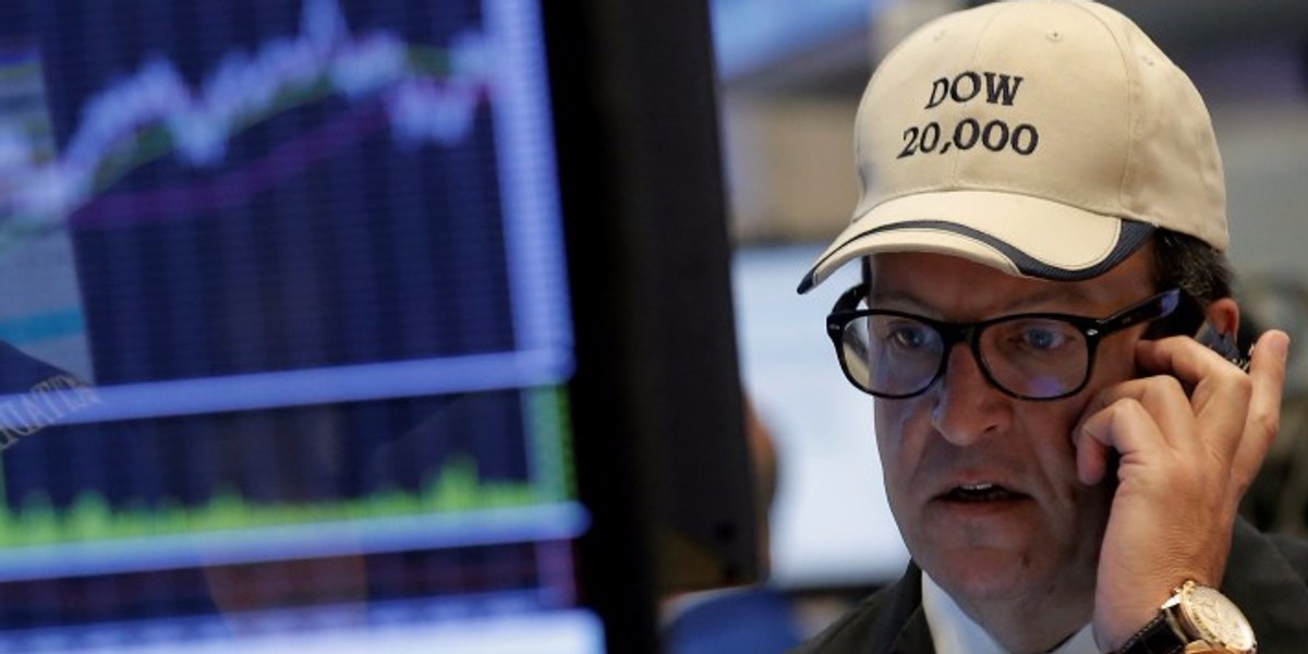 Traders work on the floor of the NYSE