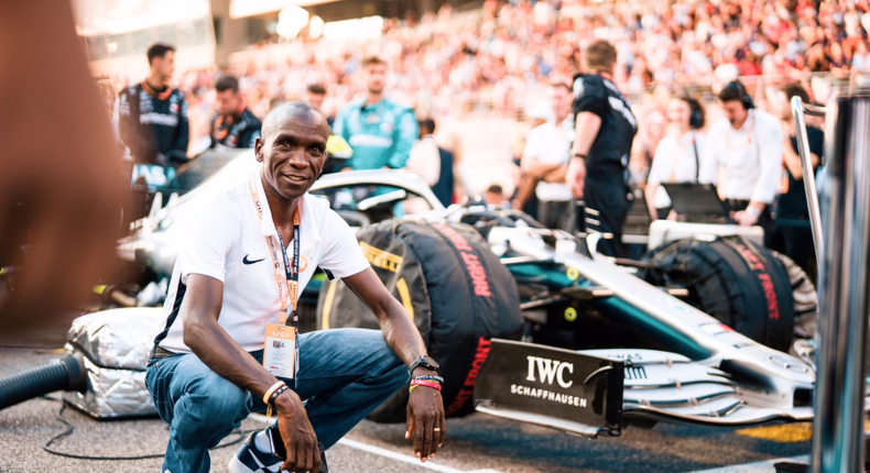 The greatest Marathoner ever, Kenyan athlete Eliud Kipchoge,  poses for a photo with Mercedes-AMG F1 on the background. (twitter.com/EliudKipchoge)