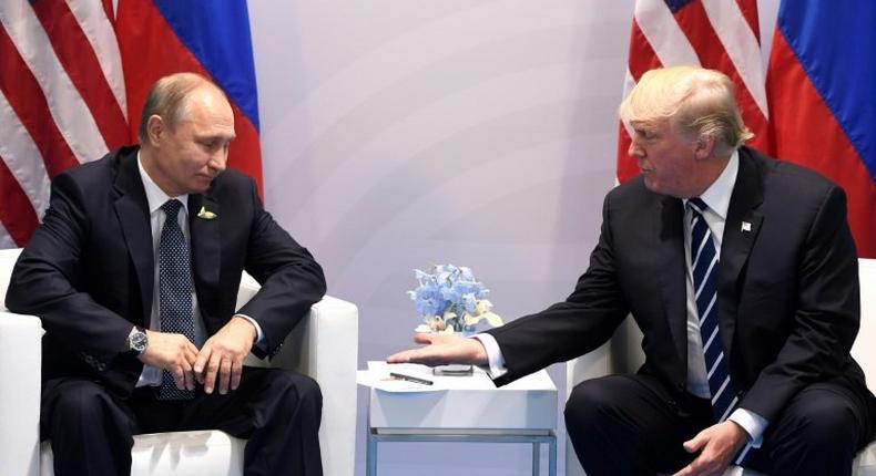 US President Donald Trump (R) and Russia's President Vladimir Putin, pictured during the G20 Summit in Hamburg, Germany, in July 2017, are to also attend a G20 gathering that begins November 26 in Argentina