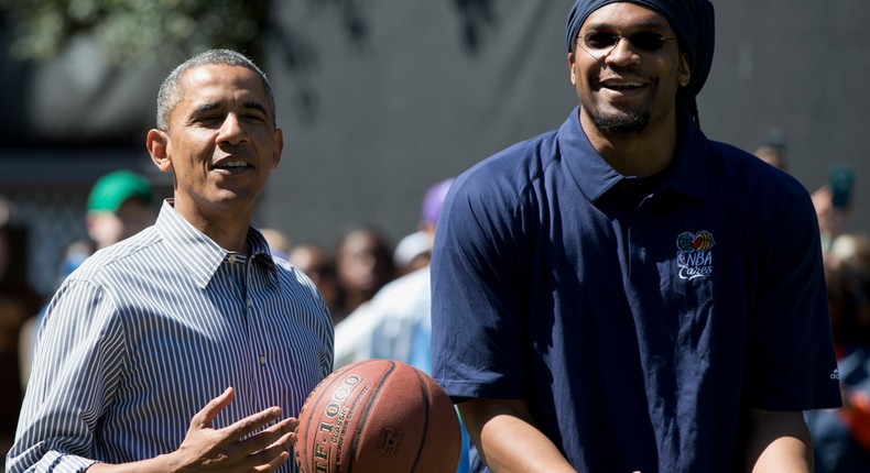 President Barack Obama and former NBA basketball player Etan Thomas playing basketball.