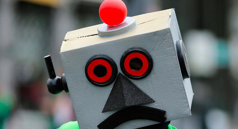 A protester dressed as a robot takes part in a march by Belgian public sector workers in central Brussels, Belgium, May 31, 2016.