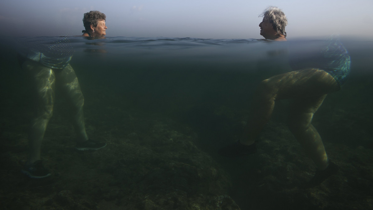 People swim at the sea in Havana