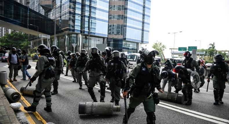 Police clear barricades left by protestors. Clashes between police and activists were less intense than at the start of October when the city was virtually shut down