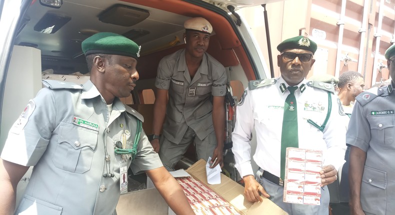 The Customs Area Controller of Apapa Command,  Comptroller Mohammed Abba-Kura  displaying the 10 cartons intercepted tramadol of 225mg in an ambulance which was arrested by the command [NAN]