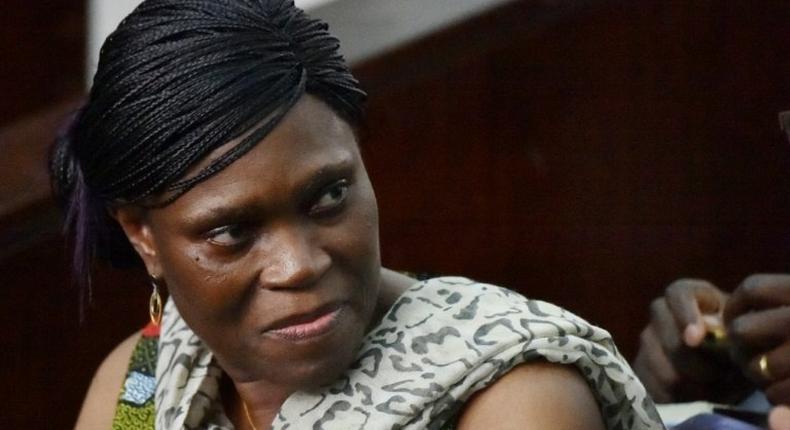 Former Ivorian first lady Simone Gbagbo looks on at Abidjan's courthouse on October 10, 2016 before the re-opening of her trial, which her lawyers said October 24, 2016 they would refuse to participate in until further notice