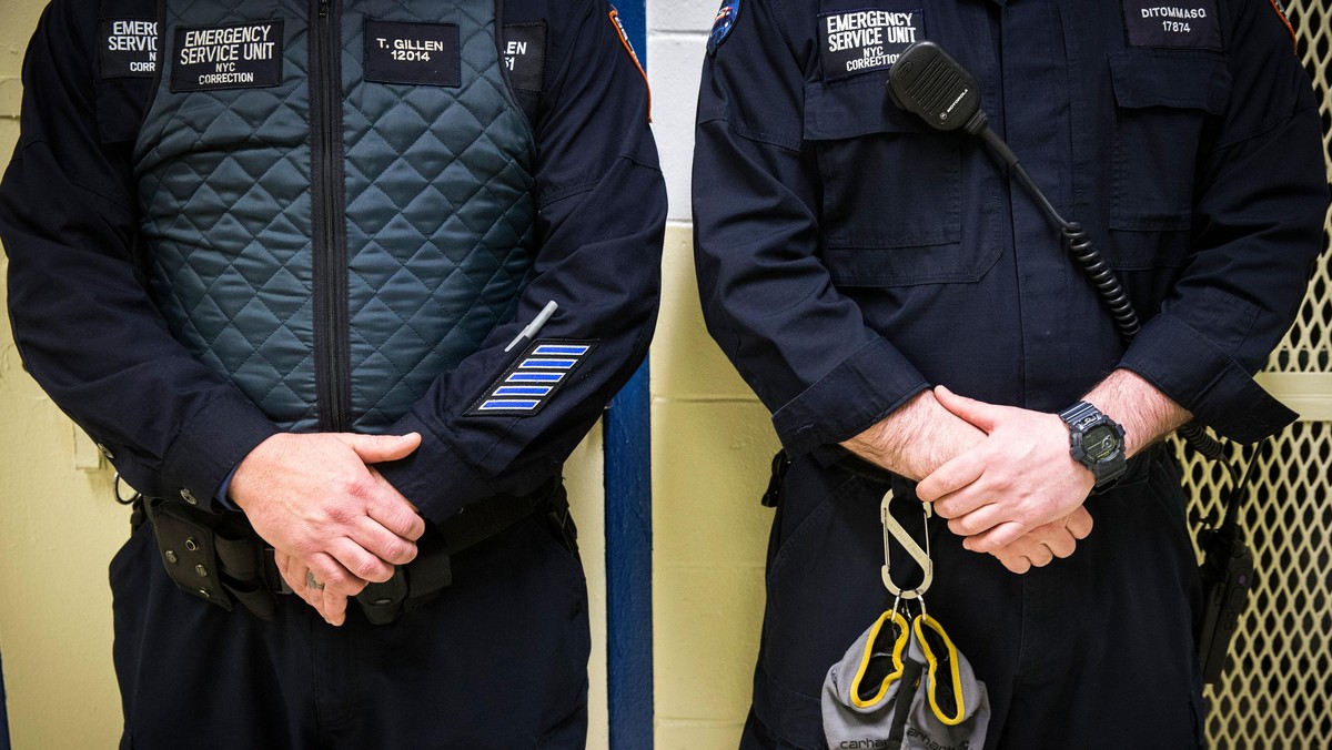 Corrections officers work in the Enhanced Supervision Housing Unit at the Rikers Island Correctional