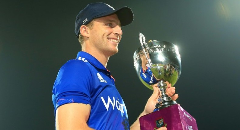 England captain Jos Buttler poses with the series trophy after his side's victory in the third ODI against Bangladesh at The Zahur Ahmed Chowdhury Stadium in Chittagong on October 12, 2016