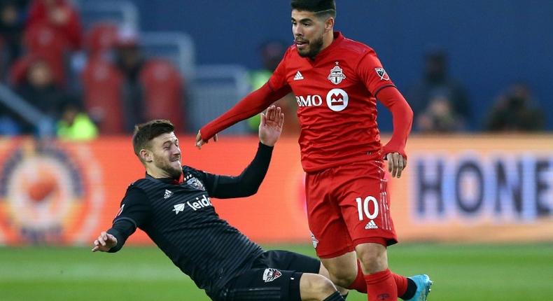 Toronto FC's Alejandro Pozuelo, evading a tackle attempt by DC United's Paul Arriola, has sparked the Canadian MLS squad in the wake of an injury to Jozy Altidore