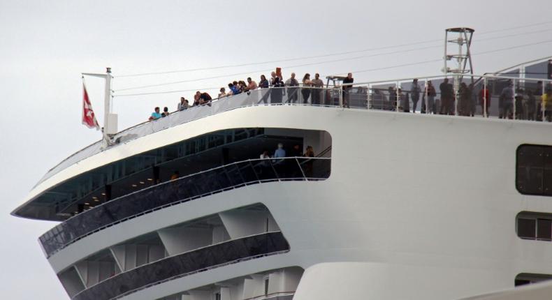 Passengers remain onboard the MSC Meraviglia cruise ship in Cozumel, Mexico, awaiting a decision on whether they can disembark