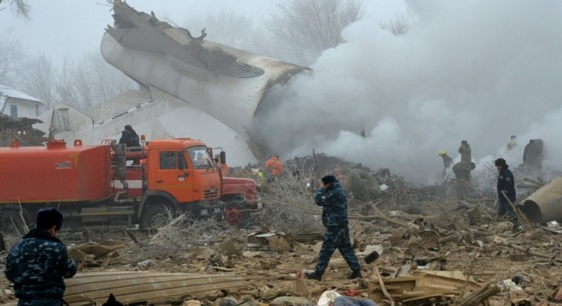 Rescue personnel work at the crash site of a Turkish cargo plane in the village of Dacha-Suu outside Bishkek, Kyrgyzstan