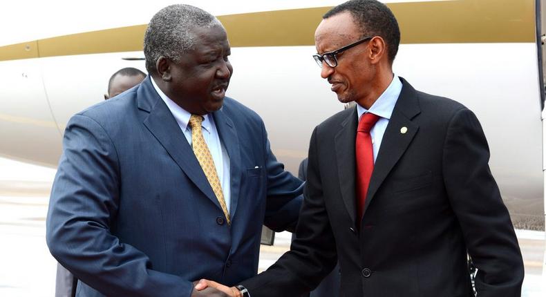 Hon Henry Okello Oryem, Minister of State for Foreign Affairs shares a friendly moment with Rwanda president Paul Kagame 