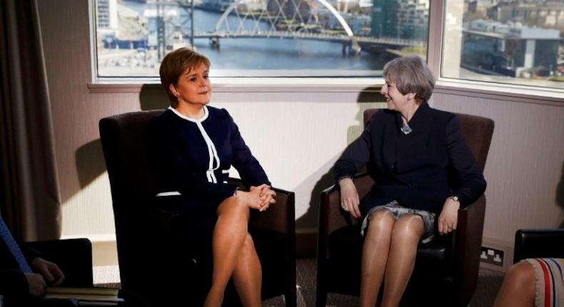 Britain's Prime Minister Theresa May (R) and Scotland's First Minister Nicola Sturgeon pose ahead of their meeting in a Glasgow hotel on Monday, but their talks failed to bridge the divide over Scottish independence