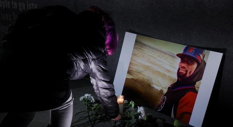 A woman leaves a flower during a vigil on the day of the release of a video showing the Memphis police beating of Tyre Nichols.Brian Snyder/Reuters