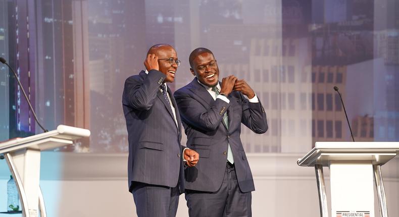 Nairobi gubernatorial candidates Polycarp Igathe of Jubilee Party (L) and Johnson Sakaja of UDA (R) react after taking part in the Nairobi Gubernatorial Debate held at Catholic University of Eastern Africa (CUEA) on July 11, 2022.