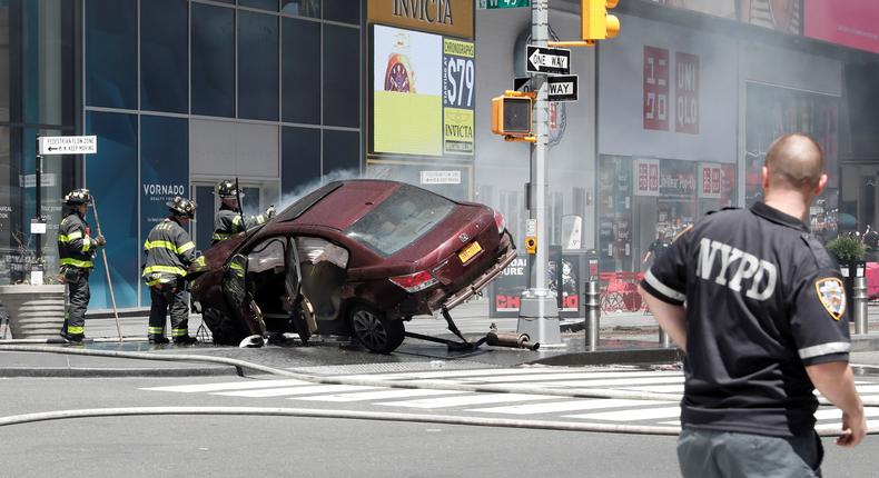 A vehicle that struck pedestrians and later crashed is seen on the sidewalk in Times Square in New York City, May 18, 2017.