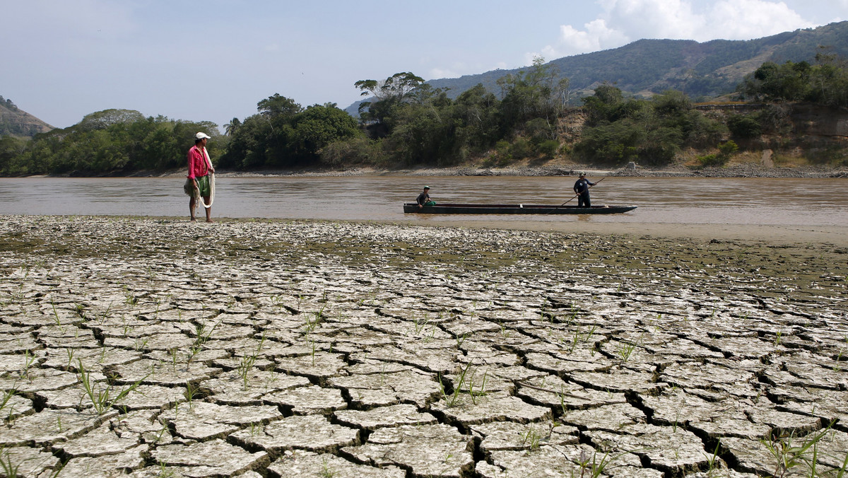 Fisherman Gabriel Barreto stands on the shore of the Magdalena river, the longest and most important river in Colombia, in the city of Honda