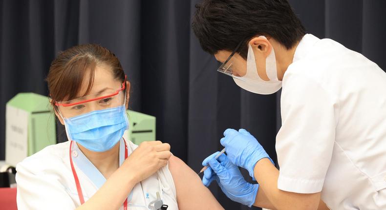 A medical worker receives a dose of COVID-19 vaccine at the Tokyo Metropolitan Cancer and Infectious Diseases Center Komagome Hospital on March 05, 2021 in Tokyo, Japan.