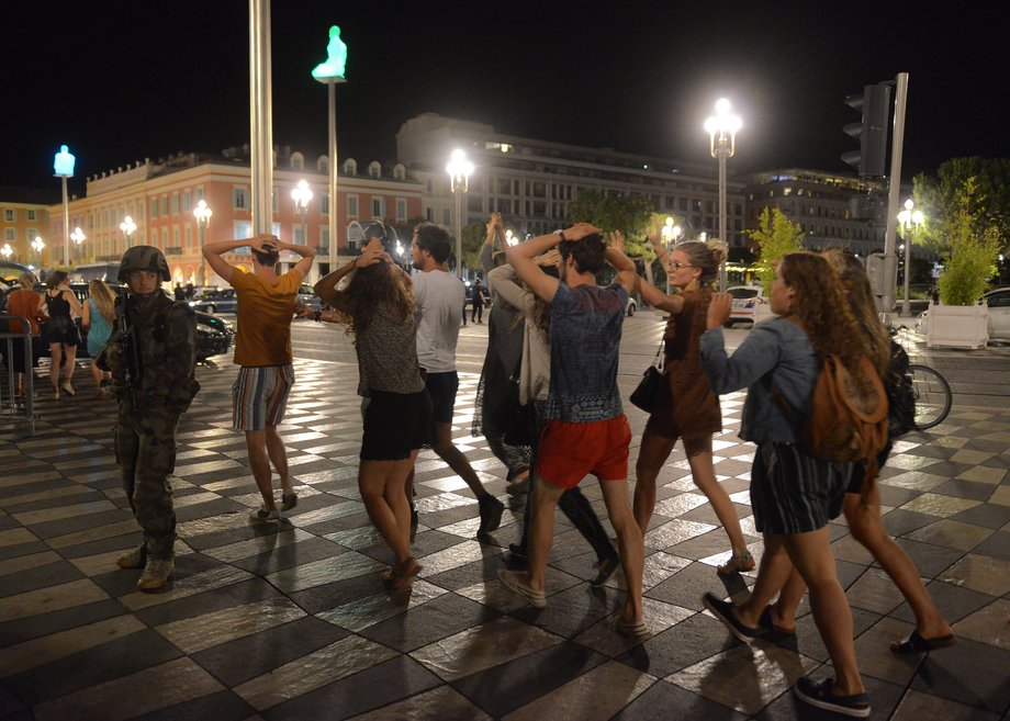 People crossing the street as a French soldier secured the area on Friday.