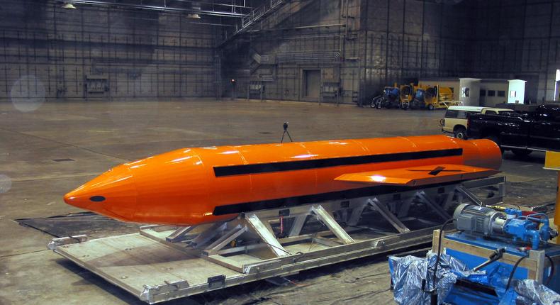 A Mother of All Bombs or MOAB weapon sits in a hangar.