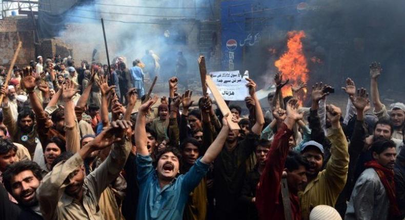 A mob (file photo) attacked a Christian couple after accusing them of desecration of the holy Koran and later burnt their bodies at a brick kiln where they worked