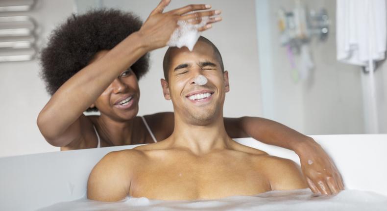 Couple sharing a bath [Credit - Madamenoire]