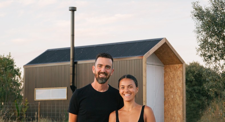 Pepe and Eugenia standing outside the completed cabin.Modern House Cabin