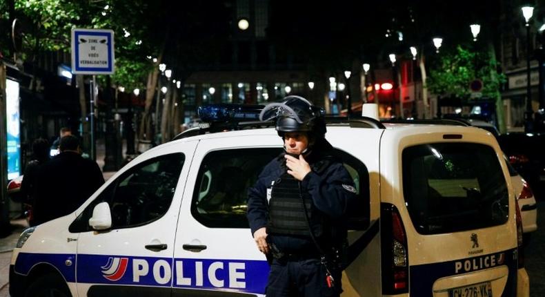 A French Police officer stands guard in front of the North station in Paris, on late May 8, 2017, during a police operation following an evacuation due to a security alert