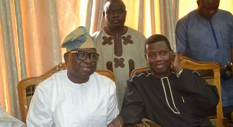 Governor Ayo Fayose (L) and Pastor Enoch Adeboye (R) 