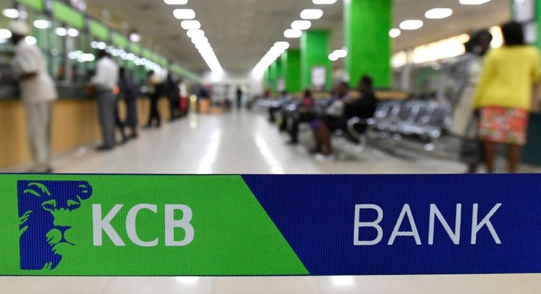 Customers are served at the Kenya Commercial Bank (KCB) in Nairobi on January 24, 2018. (Photo by SIMON MAINA/AFP via Getty Images)