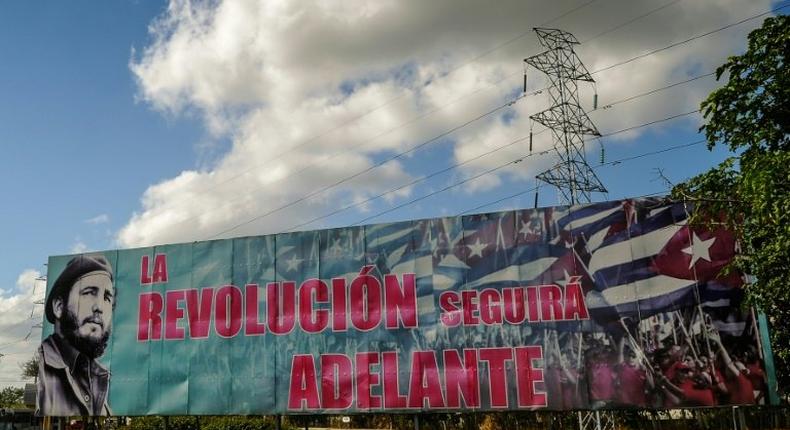 A billboard depicting Cuban revolutionary leader Fidel Castro and reading The Revolution Will Go On, is seen in Havana, on November 27, 2016 two days after his death