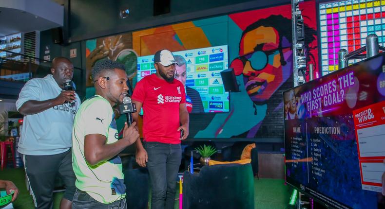 MC Lotan Salapei(left), radio presenter Fred Arocho(center) and MC Eric Njiru analyzing the predictions on screen during the Guinness brightest matchday madeby the fans at Bar Next Door, Kiambu Road