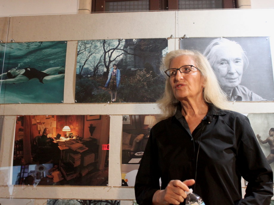 Photographer Annie Leibovitz beside her exhibit, "Women: New Portraits," in New York City.