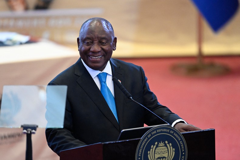 South African President Cyril Ramaphosa smiles before commencing the State of the Nation (SONA) address in Cape Town on February 12, 2026. [Photo by Rodger Bosch / POOL / AFP via Getty Images]