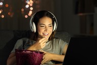 Woman watching online tv in the night