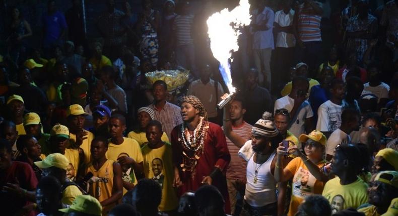 Supporters of presidential candidate Jude Celestin rally on the last day of electoral campaigning for the next presidential elections, in Port-au-Prince