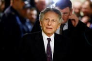 File photo of filmmaker Polanski walking on a corridor during a break of a court hearing in Krakow