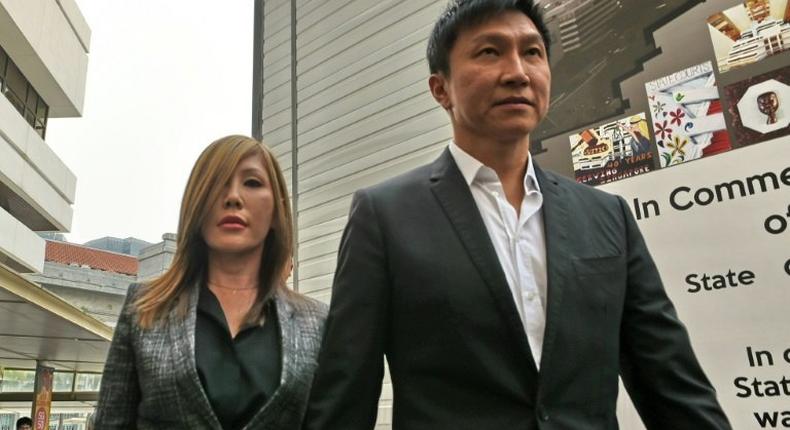 City Harvest Church founder Kong Hee (R) has had his jail sentence for misusing church funds to boost the career of his pop-singer wife Ho Yeow Sun (L) reduced on appeal