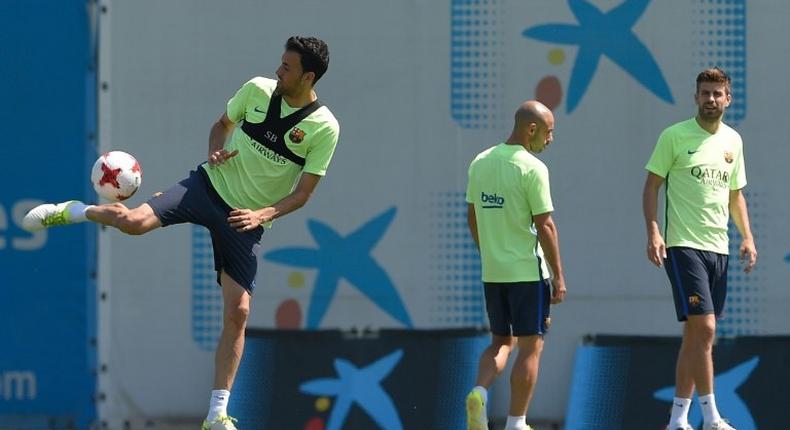 (From L) Barcelona's Sergio Busquets, Javier Mascherano and Gerard Pique take part in a training session in Sant Joan Despi on May 26, 2017, on the eve of their Spanish King's Cup final match against Deportivo Alaves