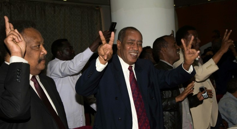 Delegation members of Sudan's transitional government react after two-week long peace talks with rebels in Juba in October