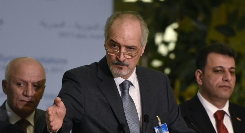 Syrian chief negotiator Bashar al-Jaafari (C), Ambassador of the Permanent Representative Mission of Syria to UN New York, speaks at a press conference on the Intra-Syria peace talks at the Palais des Nations in Geneva on March 2, 2017