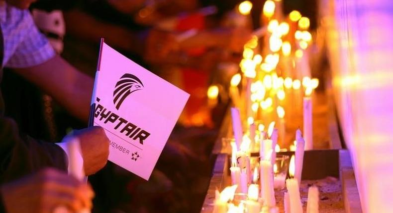 People light candles during a candlelight vigil for the victims of EgyptAir flight 804, at the Cairo Opera house in Cairo, Egypt May 26, 2016. 