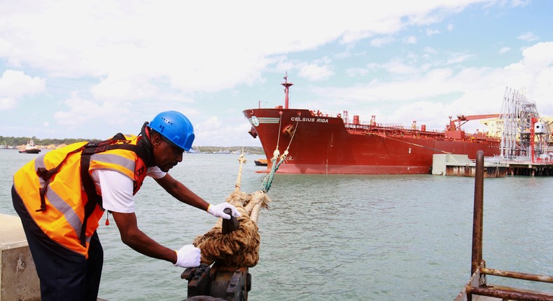 A Kenyan Ports Authority worker releases the oil tanker Celsius Riga to sail off with over 200,000 barrels of Kenya's first oil export, from the port of Mombasa, Kenya August 26, 2019.