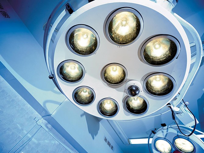 38945_stockphototwosurgicallampsinoperationroombluecastlightrepresentpurityandclinicalmoodusefulshutterstock-89667058