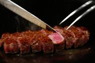 A chef cuts highest award winning female Kobe beef, which is priced 210,000 yen ($2040) per 1kg, at 