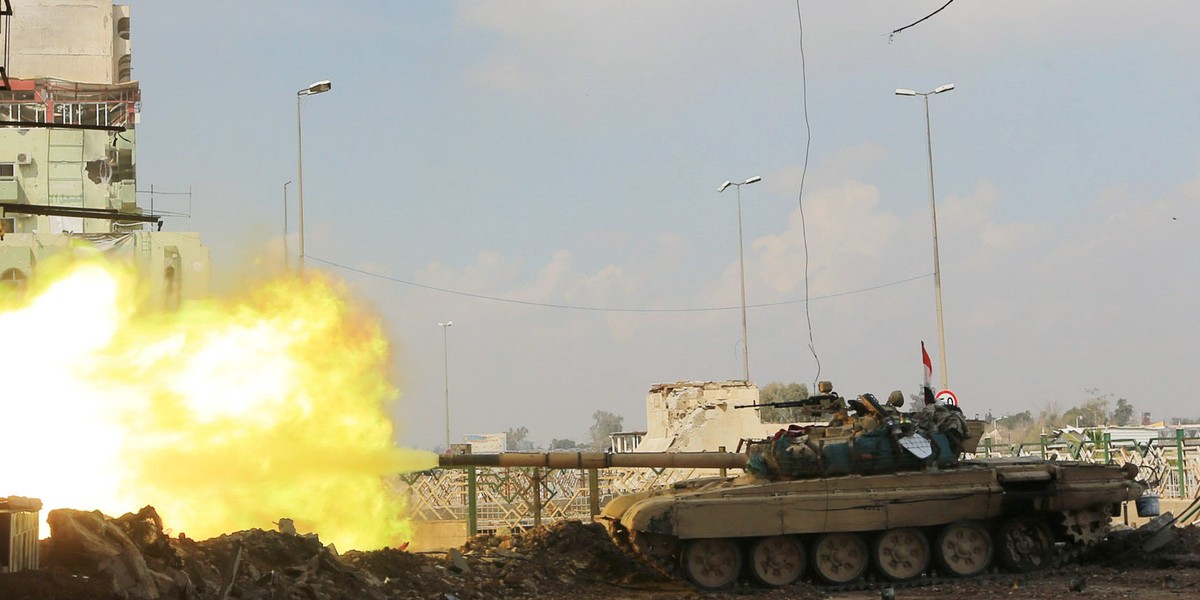 A Iraqi rapid-response forces tank fires against ISIS militants in the Bab al-Tob area of Mosul, Iraq, March 14, 2017.