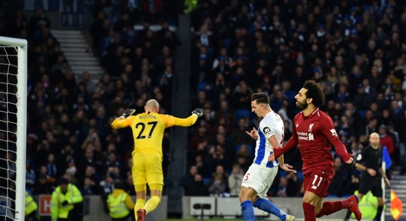 Salah strikes: Liverpool's Mohamed Salah celebrates opening the scoring against Brighton